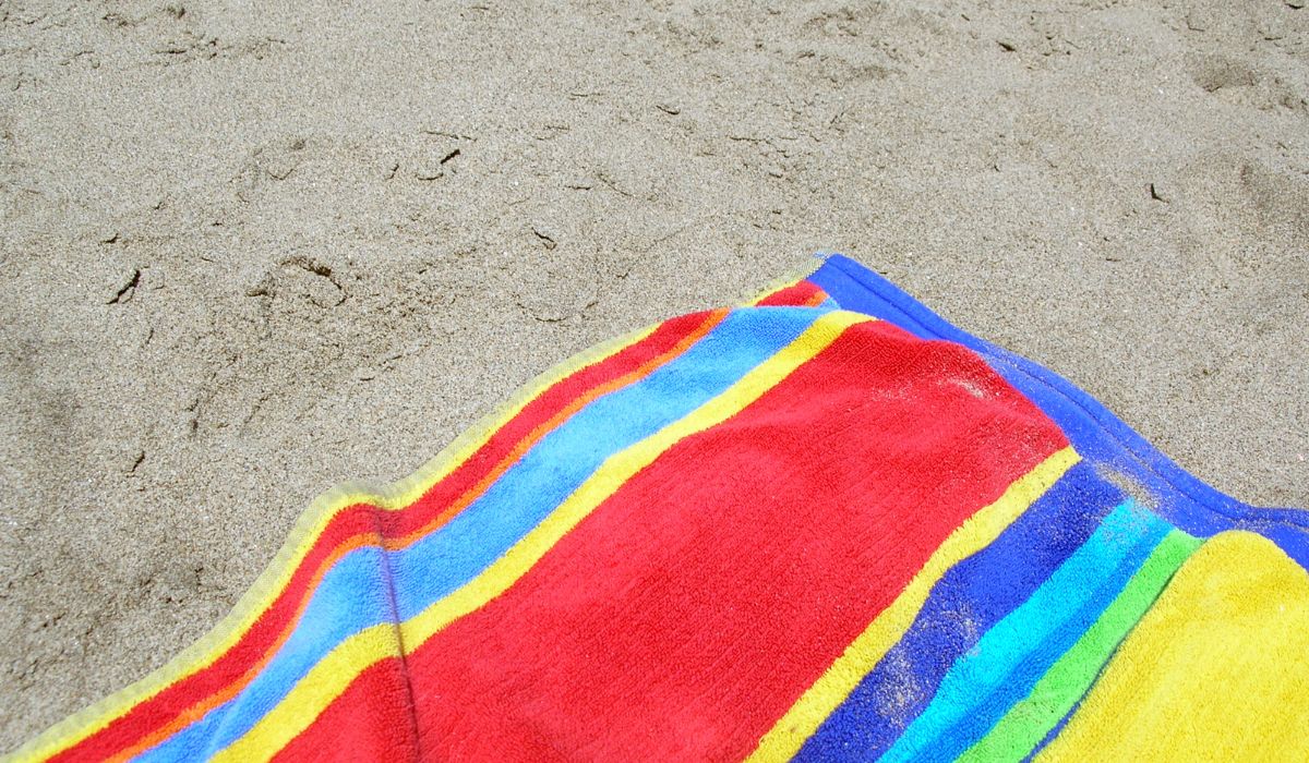 Doblar toalla playa
